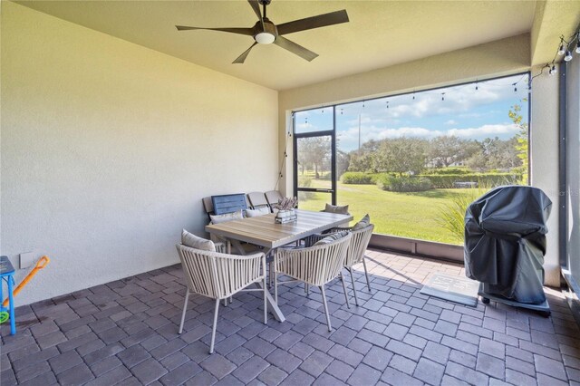 sunroom / solarium with ceiling fan