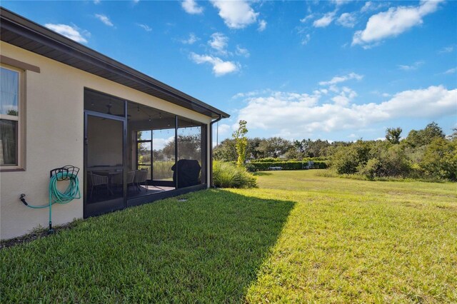 view of yard with a sunroom