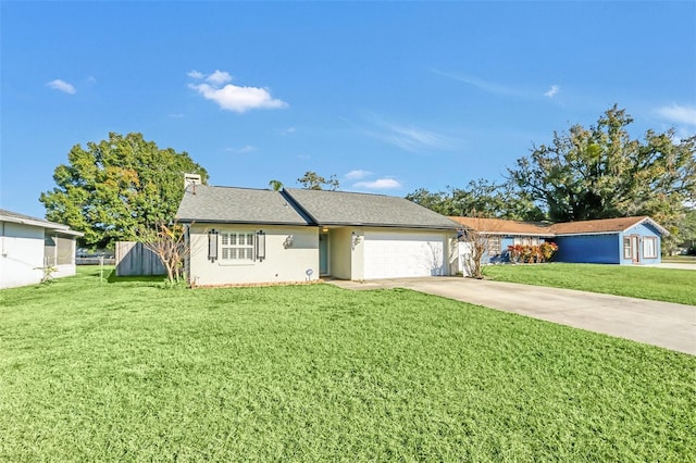 ranch-style house featuring a front yard and a garage