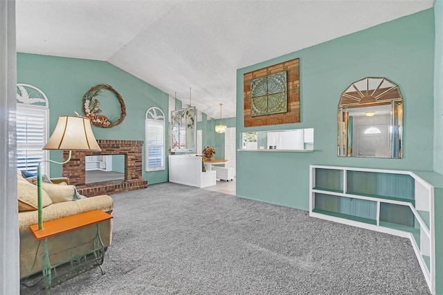 living area featuring carpet flooring, a fireplace, and vaulted ceiling