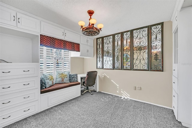 sitting room featuring carpet flooring, a textured ceiling, and an inviting chandelier