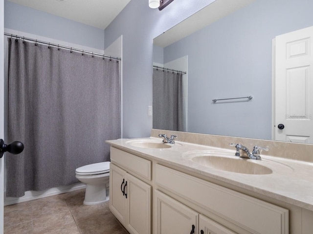 full bathroom with toilet, tile patterned floors, vanity, and shower / tub combo with curtain