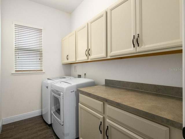 laundry area with cabinets and washing machine and clothes dryer