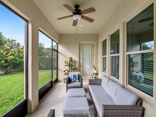 sunroom with ceiling fan