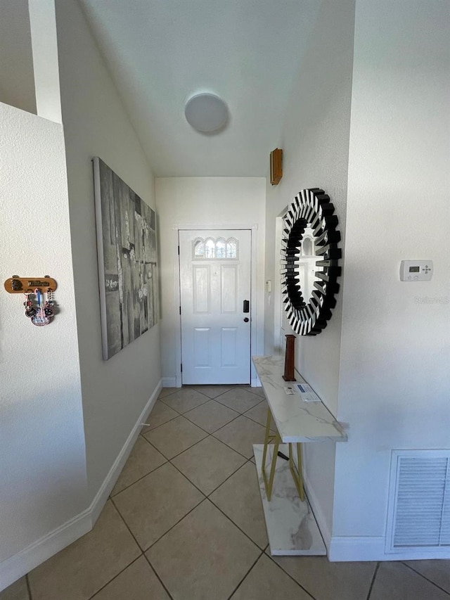 entryway with tile patterned floors