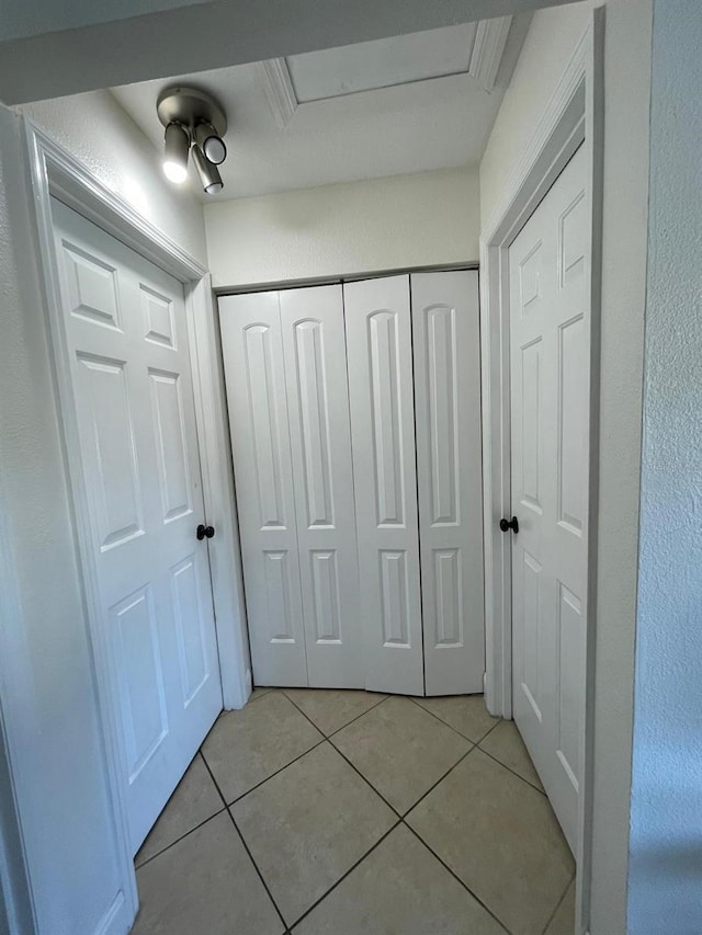 hallway with light tile patterned flooring