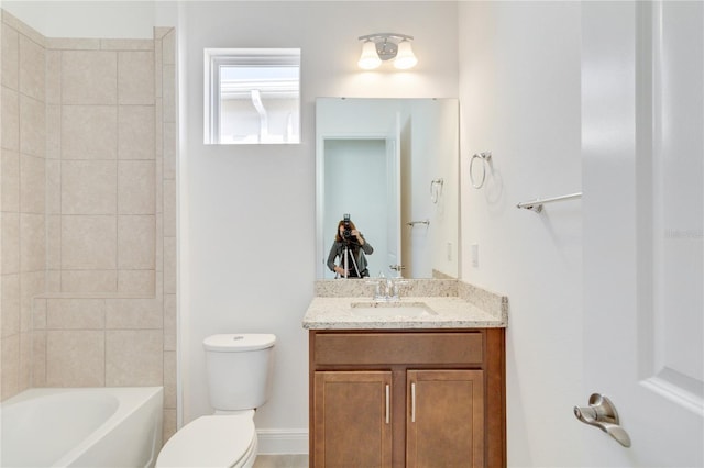 full bathroom with vanity, tiled shower / bath combo, and toilet