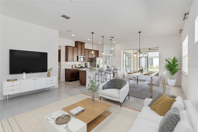 living room featuring an inviting chandelier