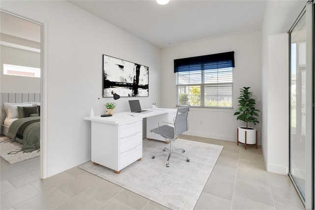 office area with light tile patterned floors