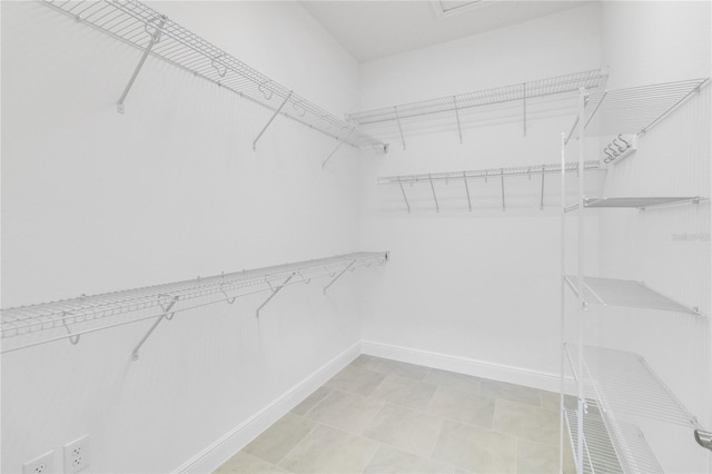 walk in closet featuring light tile patterned floors