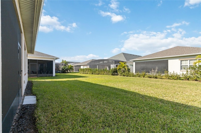 view of yard with a sunroom