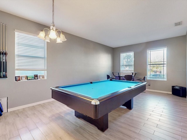 recreation room featuring light hardwood / wood-style flooring, a chandelier, and billiards