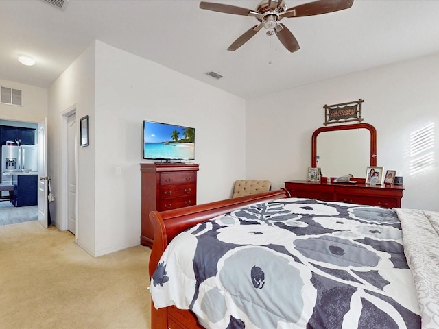 bedroom featuring ceiling fan, light colored carpet, and stainless steel fridge with ice dispenser