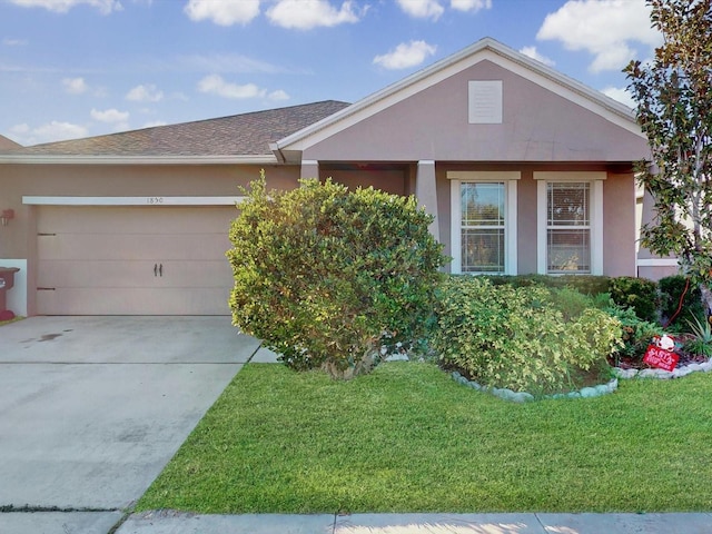 ranch-style house with a garage and a front yard