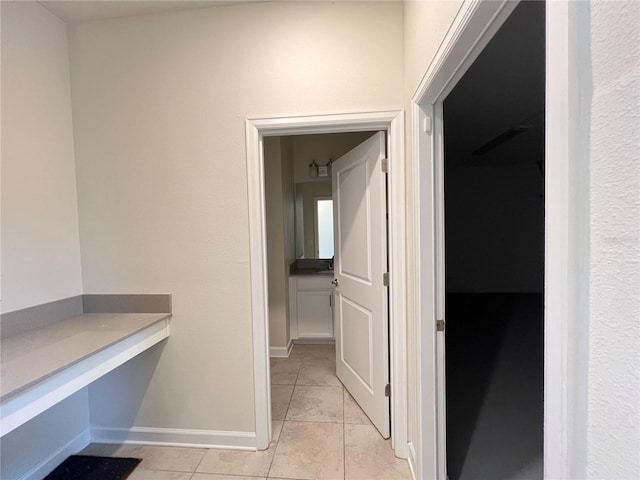 hallway with light tile patterned flooring