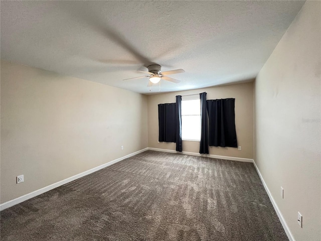 carpeted spare room featuring a textured ceiling and ceiling fan