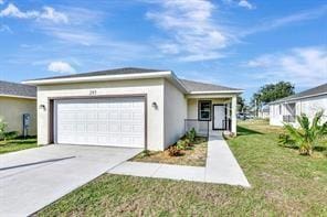 view of front of house featuring a front yard and a garage