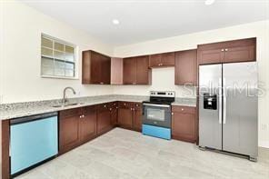 kitchen with stainless steel appliances and sink