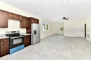 kitchen featuring electric range, ceiling fan, dark brown cabinets, and white fridge with ice dispenser