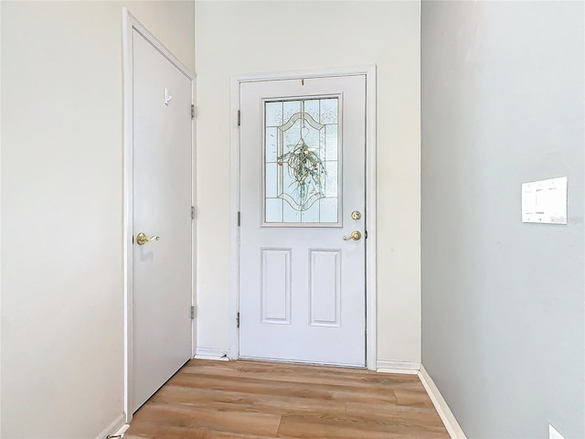 doorway to outside with light hardwood / wood-style flooring