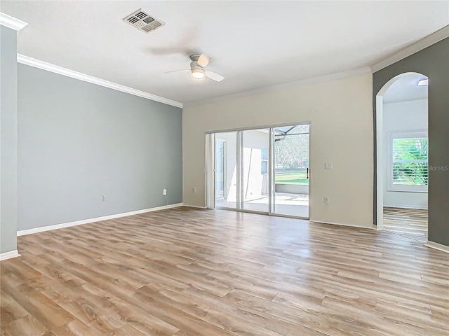 unfurnished room featuring ceiling fan, a healthy amount of sunlight, light wood-type flooring, and ornamental molding