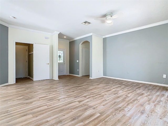 spare room with light hardwood / wood-style floors, ceiling fan, and ornamental molding