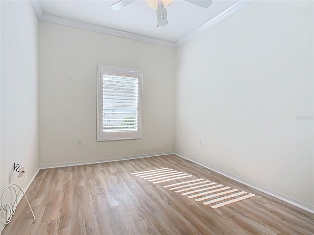 spare room with ceiling fan, light hardwood / wood-style floors, and crown molding