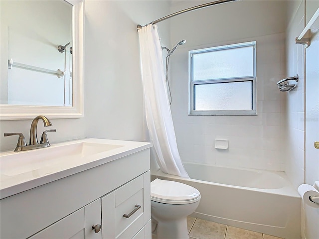 full bathroom featuring tile patterned floors, shower / bath combo with shower curtain, vanity, and toilet