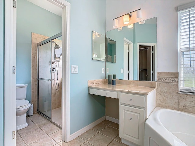 full bathroom with tile patterned floors, vanity, toilet, and independent shower and bath