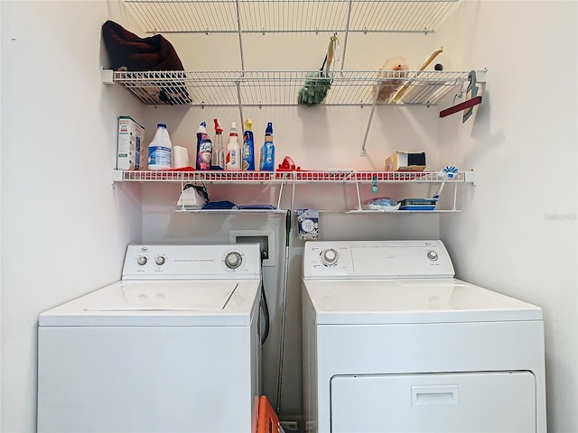 laundry room with washing machine and clothes dryer