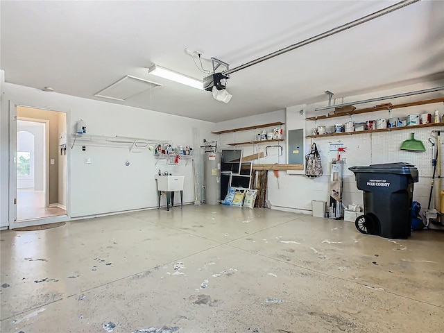 garage with a garage door opener, sink, electric panel, and water heater