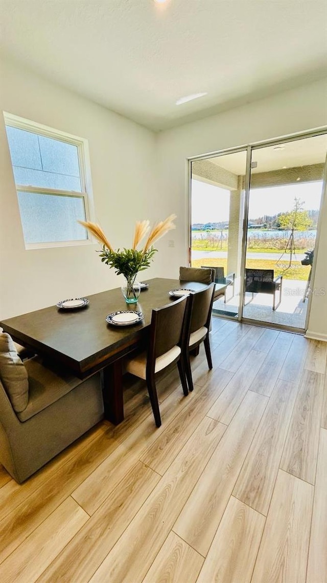 dining area with light wood-type flooring