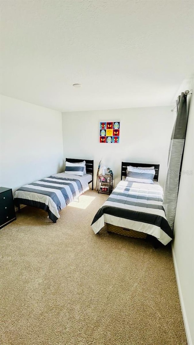 bedroom featuring carpet flooring