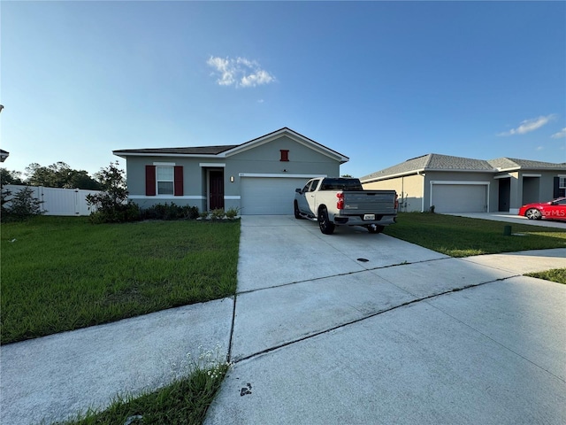 single story home featuring a garage and a front yard