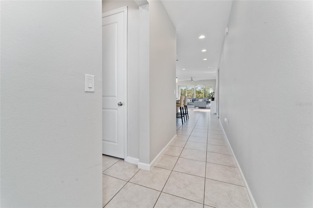 hallway featuring light tile patterned floors