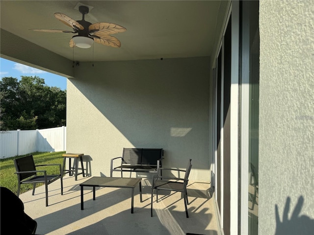 exterior space with ceiling fan