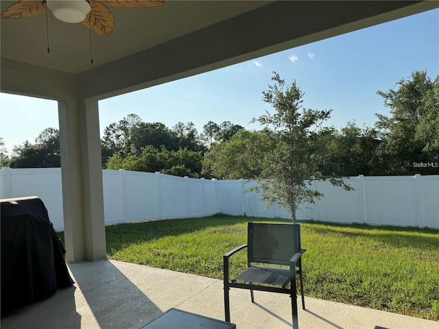 view of patio featuring area for grilling and ceiling fan