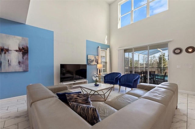 living room with a towering ceiling