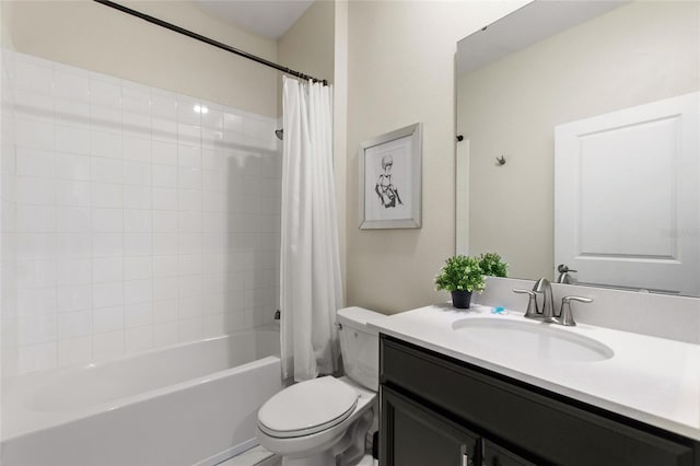 full bathroom featuring shower / bath combo with shower curtain, vanity, and toilet