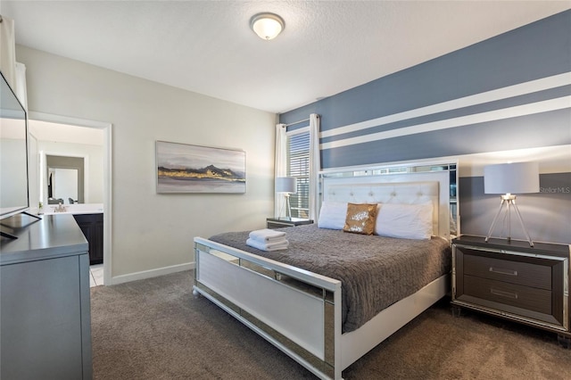 bedroom with dark colored carpet