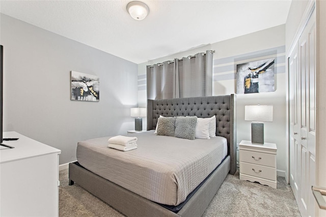 carpeted bedroom featuring a closet