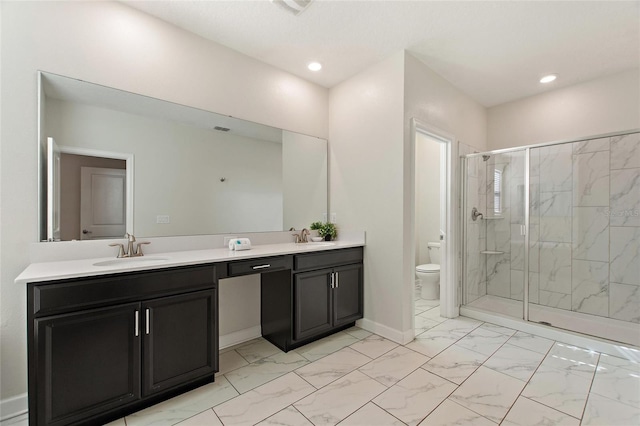 bathroom with an enclosed shower, vanity, and toilet