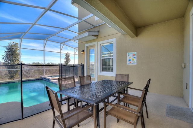 exterior space featuring a patio area, a lanai, and an in ground hot tub