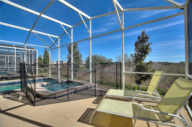 view of pool featuring a lanai, a patio area, and an in ground hot tub