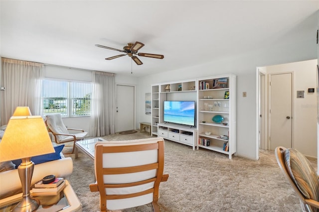 living room featuring carpet floors and ceiling fan