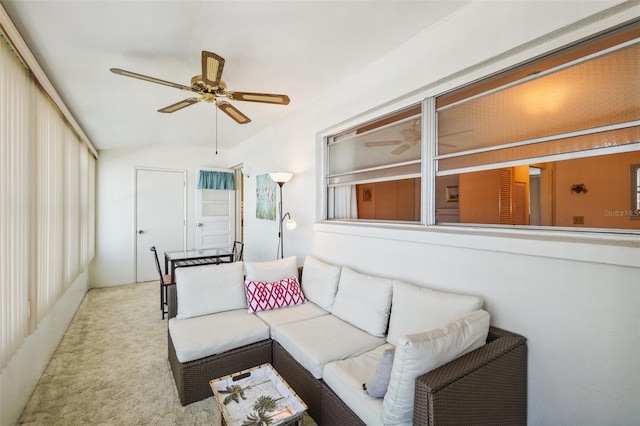 carpeted living room featuring ceiling fan