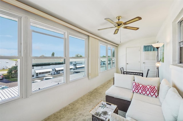 sunroom featuring ceiling fan