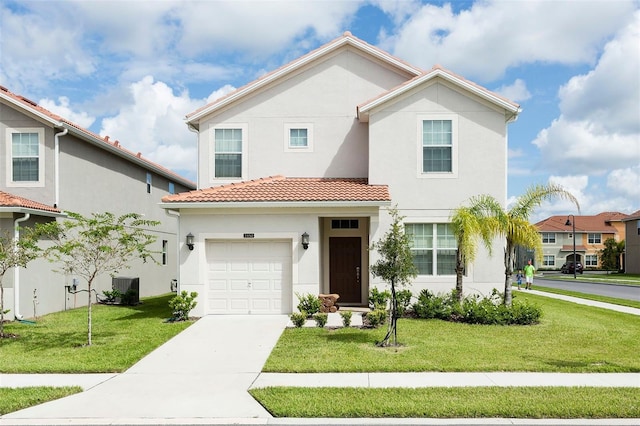 view of front of home featuring cooling unit, a front lawn, and a garage