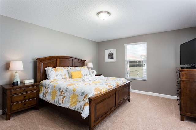 carpeted bedroom featuring a textured ceiling