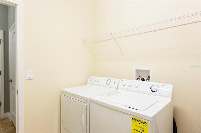 laundry area with independent washer and dryer